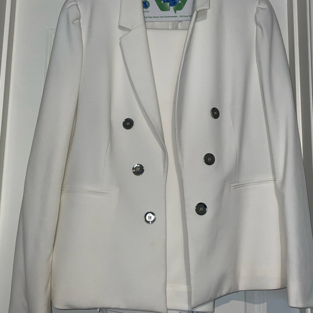 White suit gold accent buttons